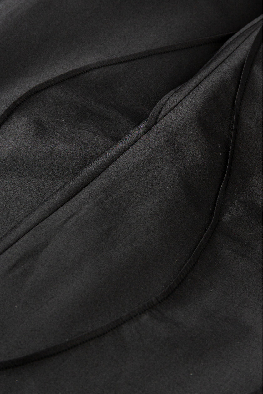 Close-up of black fabric with folds