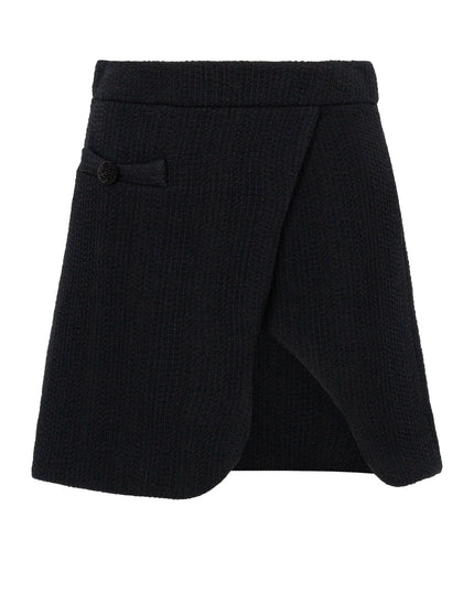 Black skirt with a button detail on a white background