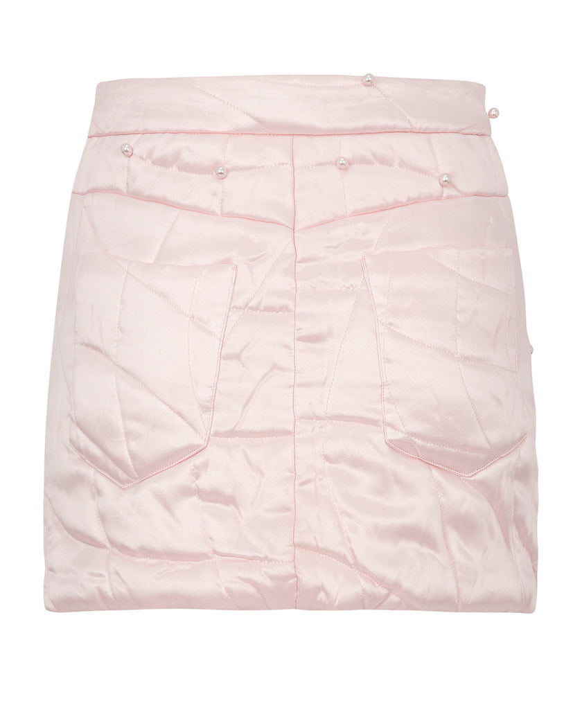 Pink quilted skirt on a white background
