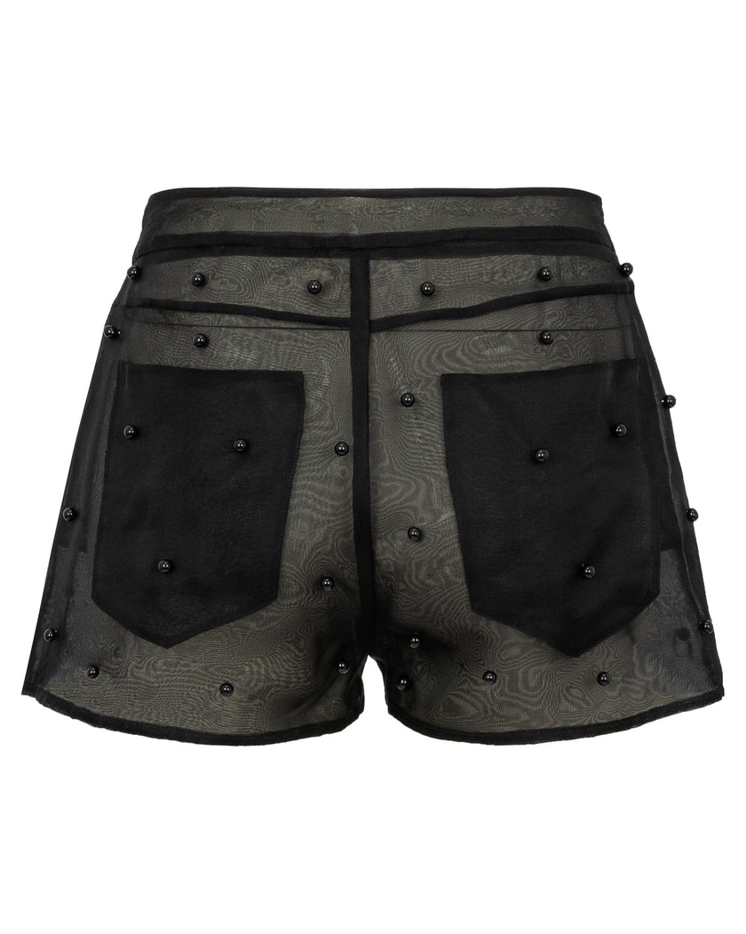 Black shorts with patterned design and embellishments on a white background