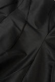 Close-up of black fabric with folds