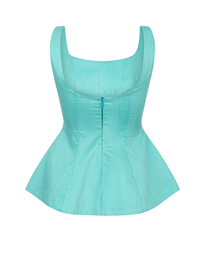 Turquoise swimsuit top on a white background