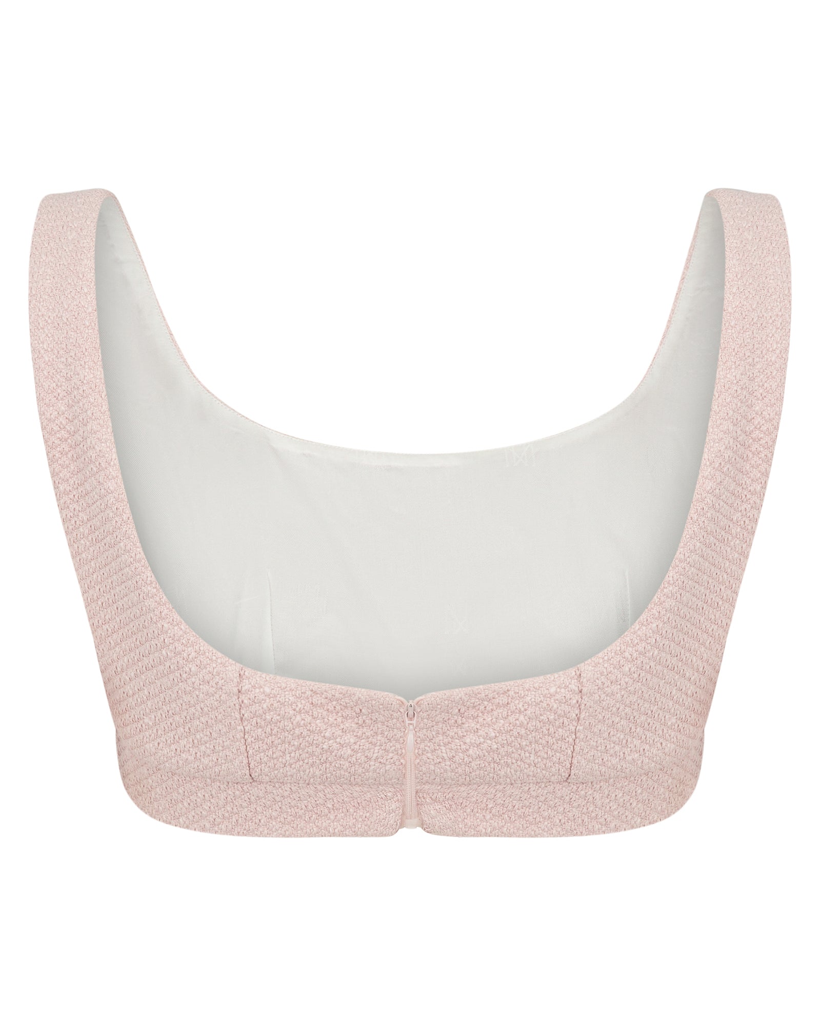 Pink textured bralette on a white background