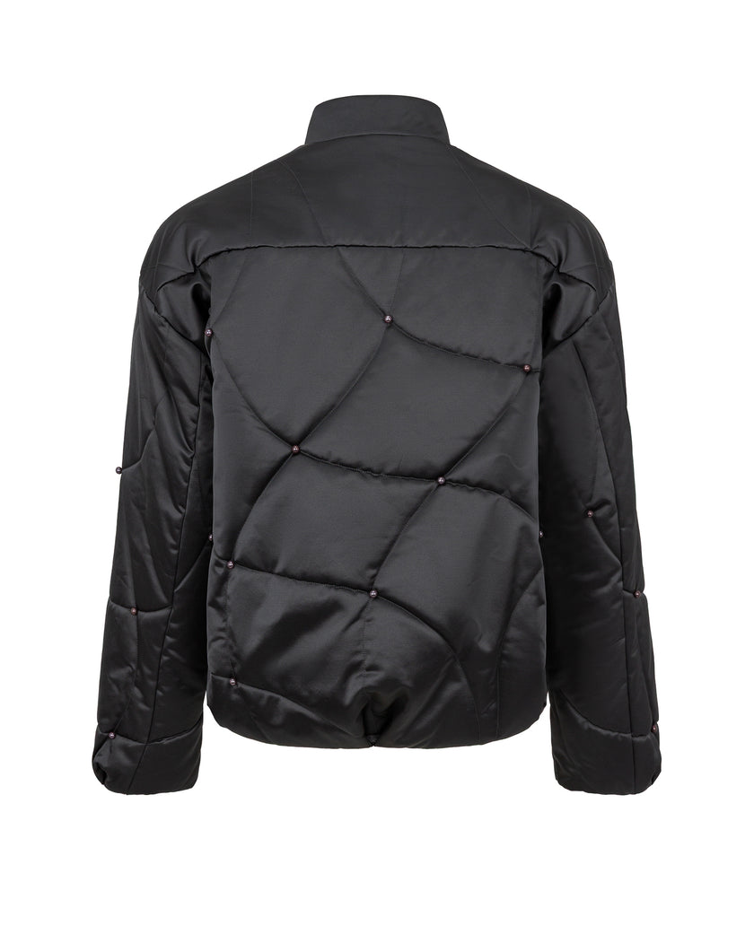 Black quilted jacket on a white background