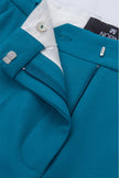 Close-up of a blue jacket with a brand label on a white background