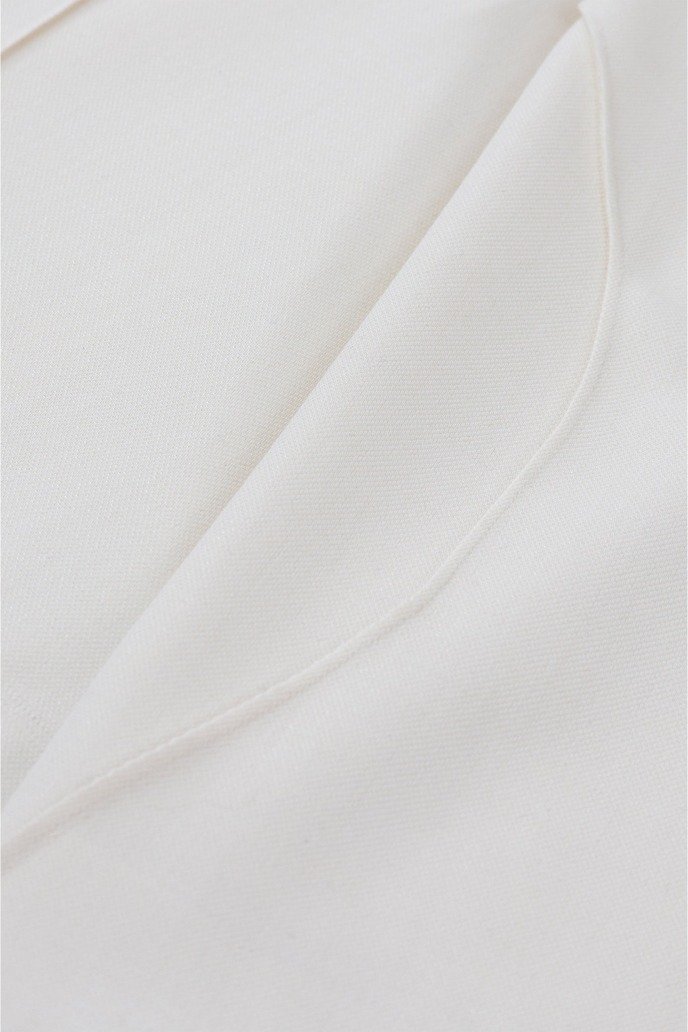 Close-up of white fabric with folds