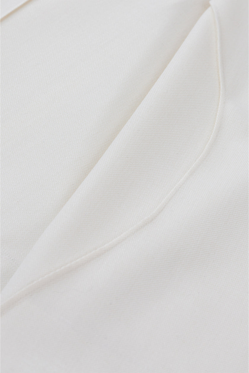 Close-up of white fabric with folds