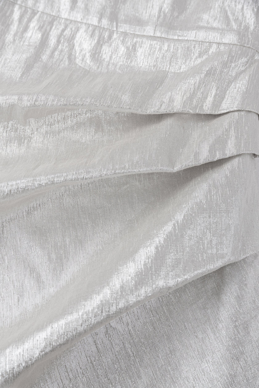 Close-up of textured white fabric with folds