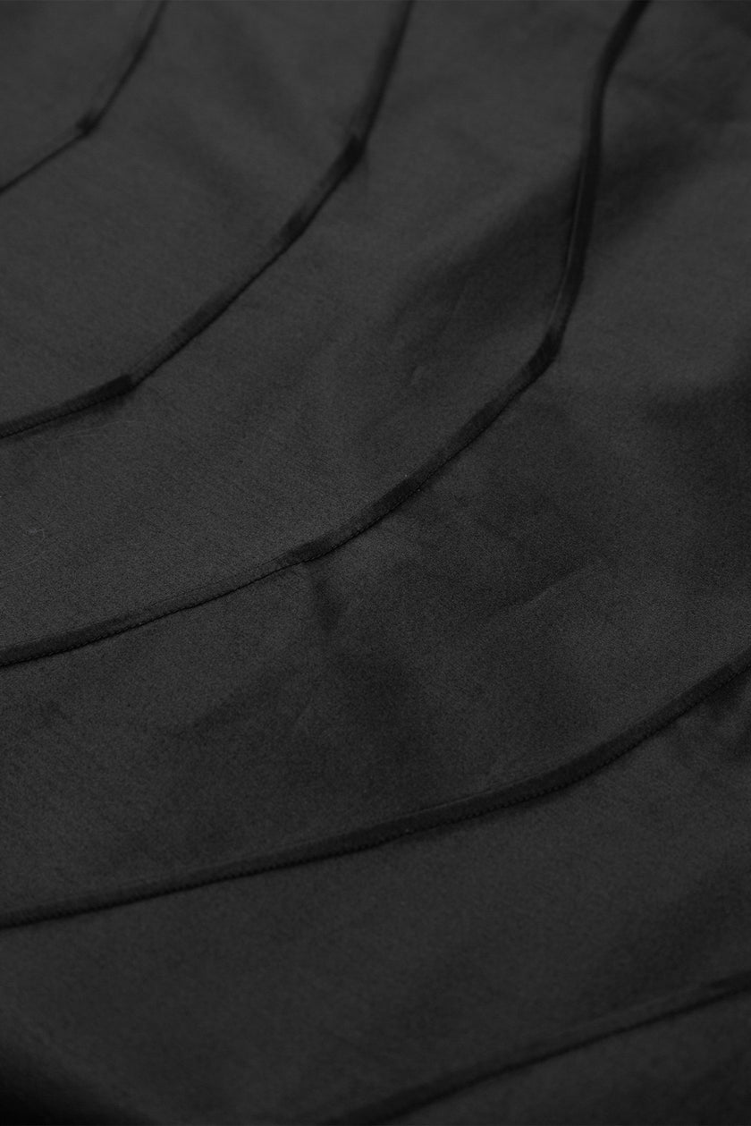 Close-up of black fabric with folds