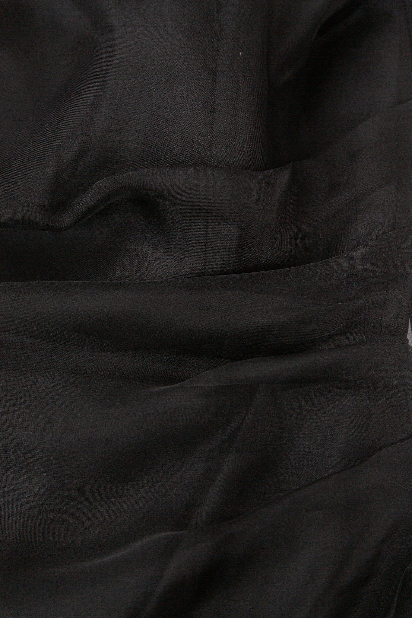 Close-up of black fabric with folds