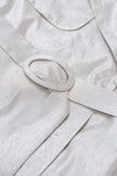 Close-up of a light gray fabric with a belt